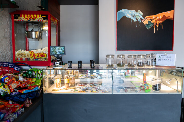 The retail counter with popcorn machine and flower jars